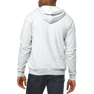 The back of a man standing and wearing a light gray hooded zipup with dark jeans.