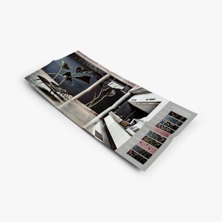 A six-panel brochure laying unfolded and printed with an image of a lobby and reception area.