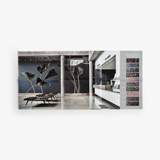 An unfolded six-panel direct mail brochure printed with an image of a reception and lobby area.