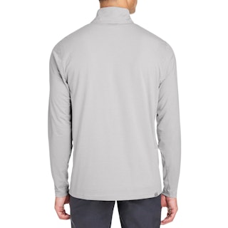 The back of a man wearing a Puma zipup pullover in solid light gray color.