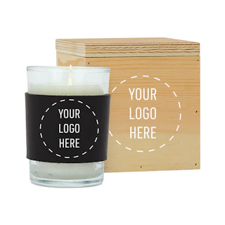 A candle with a black sleeve and wooden box with Your Logo Here on the sleeve and box.