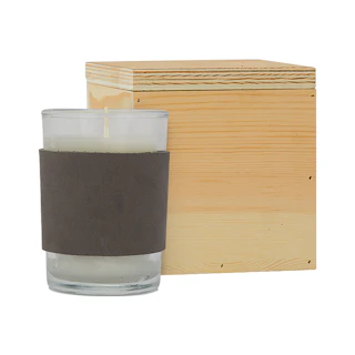 A personalized custom candle with a brown leather sleeve and a wooden gift box.