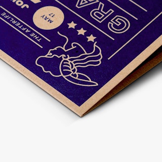 The corner of an announcement printed on Kraft paper with a blue grand opening design on the front.