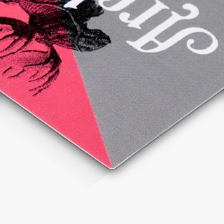 The top corner of a custom bookmark printed in pink and gray with a black moose graphic.