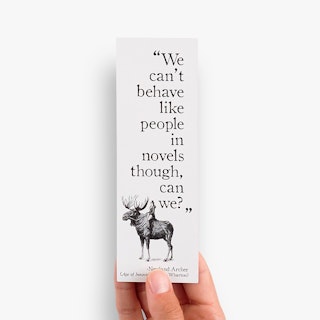 A hand holding a bookmark printed with
