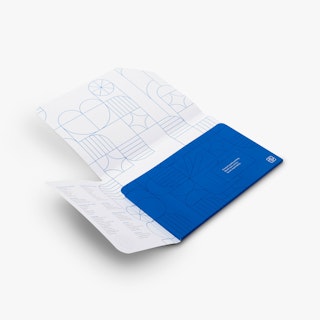 A custom folder laying open with a blue and white abstract and geographic design and contact info.