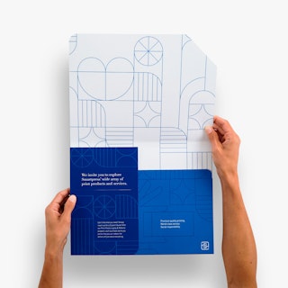Two hands holding a branded folder open with a blue and white geographic design.