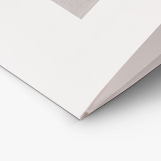 The bottom corner of a custom brochure printed with a tri-fold format and white background.