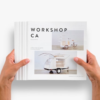 Two hands holding a stack of fanned-out square brochures printed with Workshop CA on the cover.