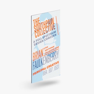 A business card magnet printed with The Southpaw Collective in orange and a boxer graphic in blue.