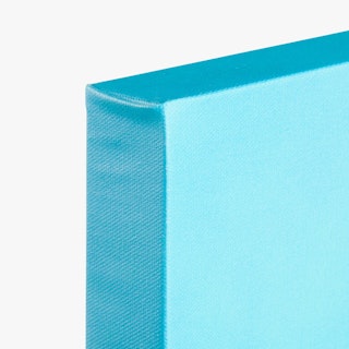 The corner of a canvas print printed in solid light blue.