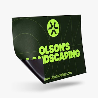 A custom car magnet printed with a black background and Olson's Landscaping in lime green.