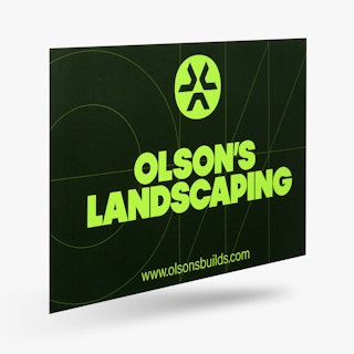 A car magnet custom printed with Olson's Landscaping in black and lime green.