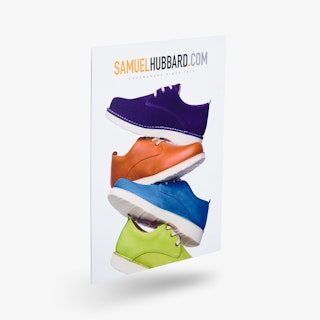 A custom cardstock sign printed with four shoes stacked on top of each other in purple, orange, blue and green.