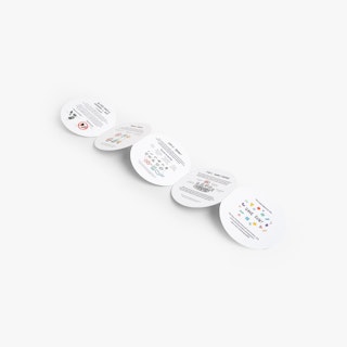 An unfolded accordion brochure with five round panels printed with various colorful graphics.