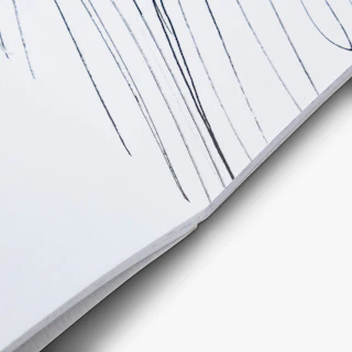 The spine of a custom coloring book laying open to a black and white illustration.