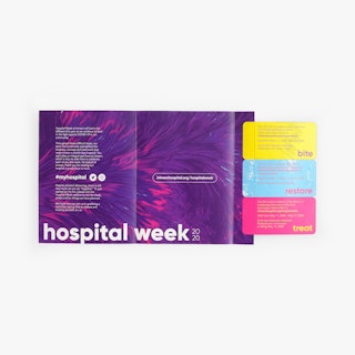 A custom coupon mailer laying unfolded with three perforated coupons in yellow, blue and pink.