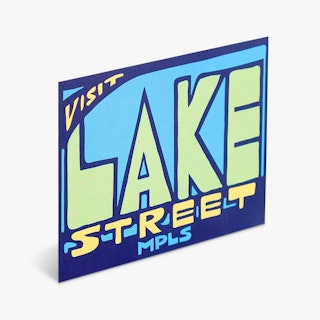 A custom decal printed with Visit Lake Street MPLS in dark blue, light blue, green and yellow.