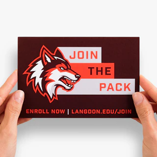 Two hands holding a school recruitment postcard printed with Join the Pack and a wolf graphic.