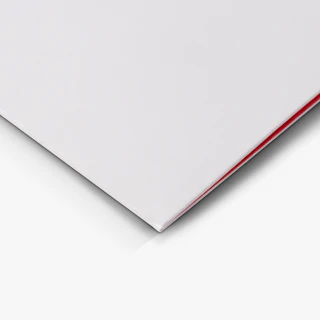 The bottom left corner of a pocket folder printed with a white cover and orange interior.