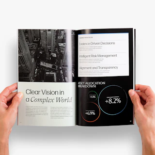 Two hands holding open an investment guide to pages printed with asset details and black and white imagery.