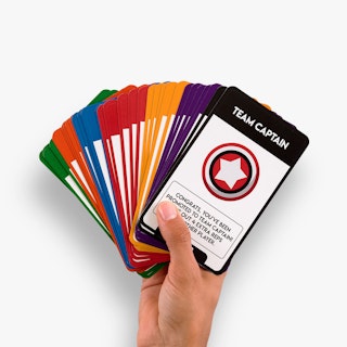 A hand holding a stack of colorful hockey training flashcards fanned out.