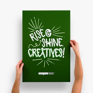Two hands holding a business sign printed on foam board with a green and white design.