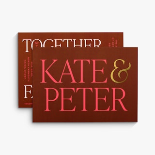 Two foil wedding invitations overlapping each other and printed with Kate & Peter in red and gold foil.