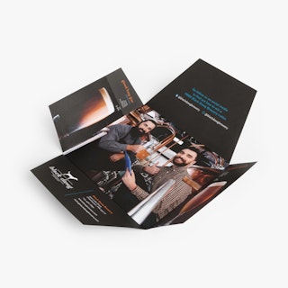 A custom booklet envelope with four panels open and marketing content printed on the inside.