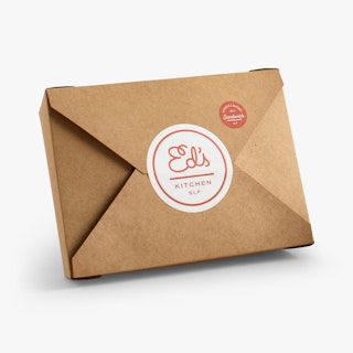 A brown take-out box secured with a food label printed with Ed's Kitchen SLP in white and red.