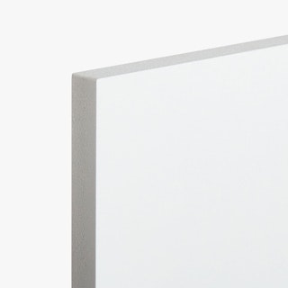 The top corner of a sign printed with a solid white edge and background.