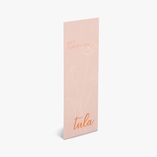 A custom printed gift certificate with Tula in orange and a pink and white floral design.