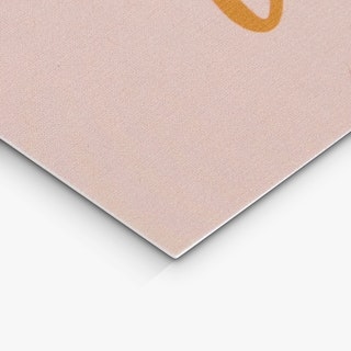 The bottom corner of a custom gift certificate printed with a light pink background.