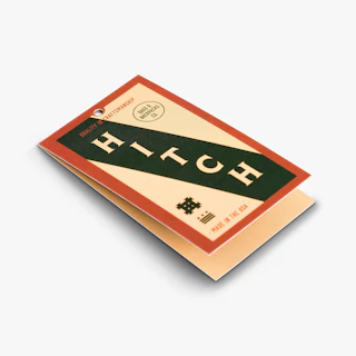 A apparel hang tag printed with a center drill hole and Hitch branding in green and orange.