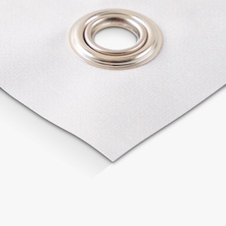 The bottom corner of a hanging banner printed with a grommet.