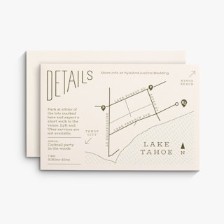 Two wedding map cards overlapping each other and printed with directions and venue details in dark green.
