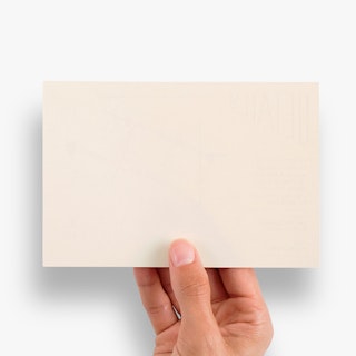A hand holding a custom map card and showing a blank back.
