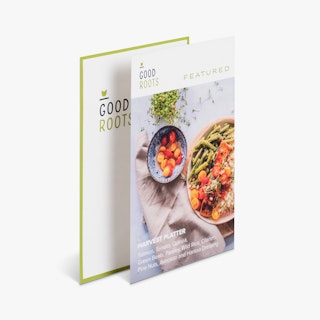 Two menu inserts overlapping each other and printed with Good Roots and an image of two bowls of food.