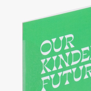 The corner of a direct mail newsletter printed with a green background and Our Kinder Future in white.