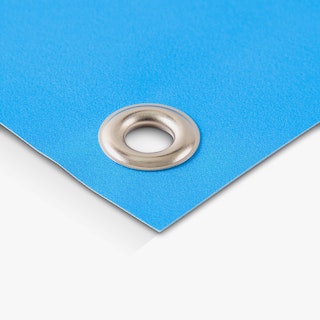 The bottom corner of a hanging banner with a silver grommet.