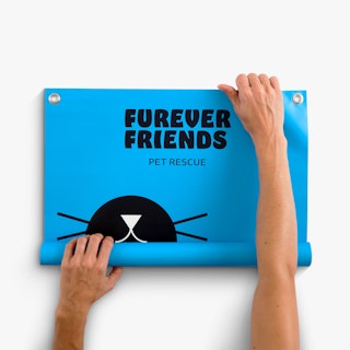Two hands unrolling a hanging banner printed with Furever Friends Pet Rescue in black and blue.