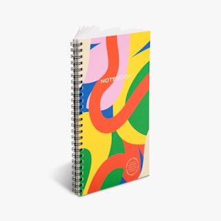 A custom notebook printed with a black wire coil binding and a multi-color abstract design on the cover.