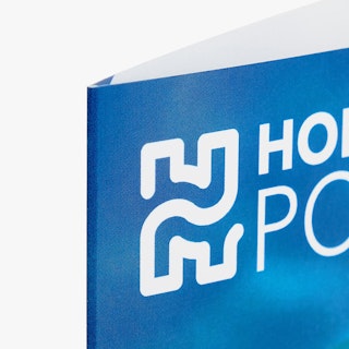 The top corner of a custom pamphlet printed with Hofmann Pools in white on a blue background.