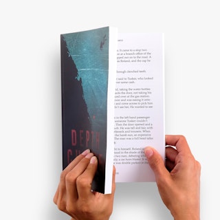 Two hands holding a paperback book open with Depth Charge in red on the cover.