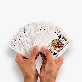 Two hands holding a custom deck of playing cards fanned out.