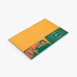 A pocket folder laying open with an orange and green design and an image of two people eating.