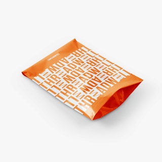 A custom poly mailer with a gusset at the bottom printed with Threadwell in an orange and white design.