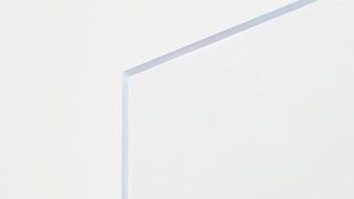The corner of a clear acrylic sign with nothing printed on it.