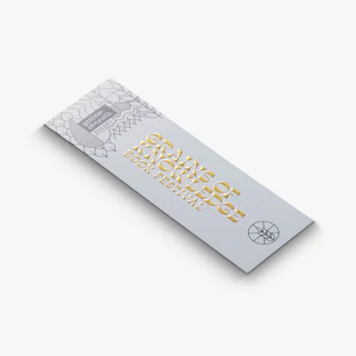 A foil bookmark printed with Grains of Knowledge Book Festival in gold foil.