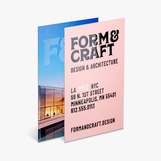 Two custom business cards printed with a raised UV coating and Form & Craft in black.